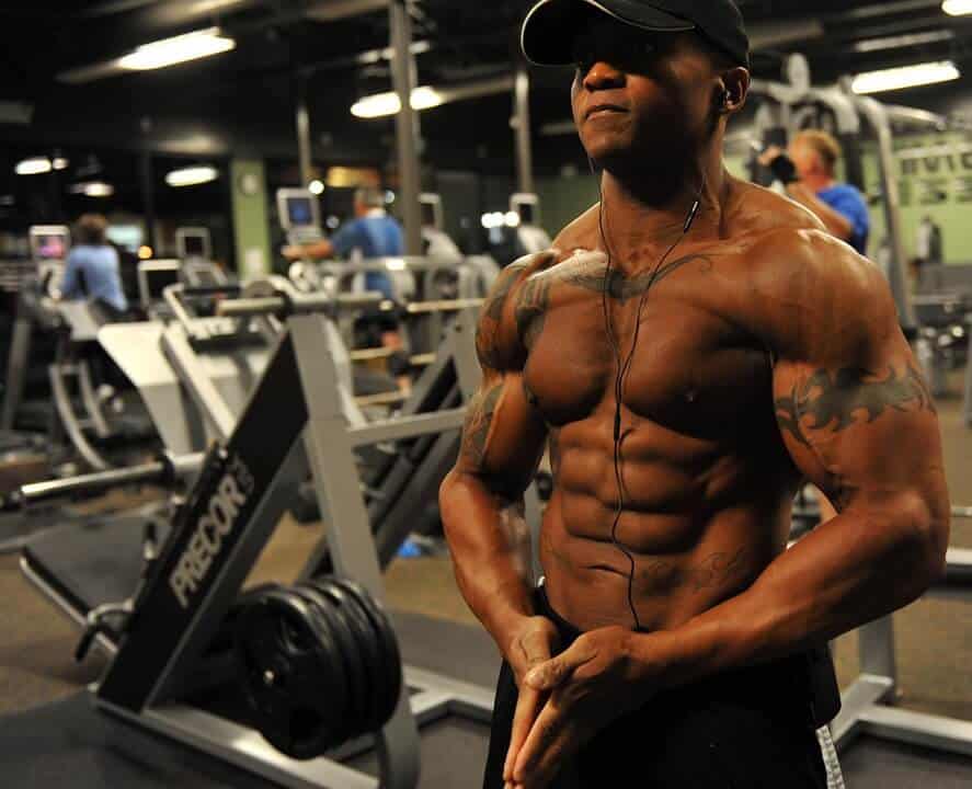 Shirtless muscular man inside a gym