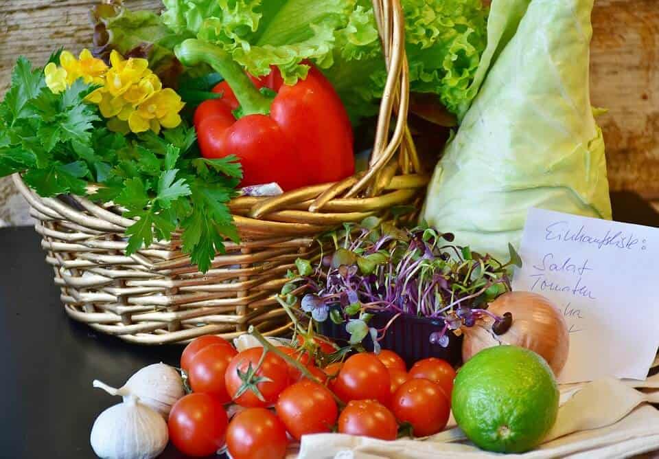 Fresh and vibrant vegetables inside basket made of wicker